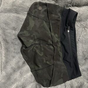 Slight discoloration to right front. Super cute green/black camouflage.